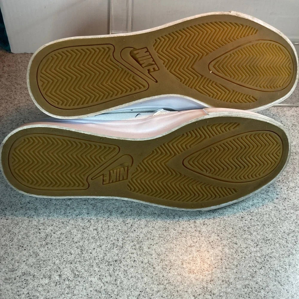 Size 9.5 Nike white slip on surfer skater‎ style with swooshes all over. 5